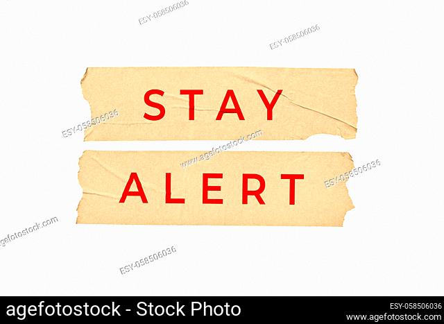 Stay alert concept. Tape stickers with text isolated on white background