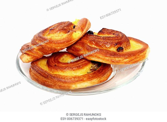 Homemade buns with raisins isolated over white background