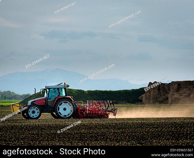 Farmer on a tractor on a field