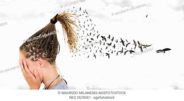 In a surreal sky, swallows come out from the braids of a girl who covers her face in front of many clouds