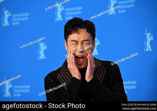 18 February 2023, Berlin: Xin Baiqing, actor, stands in front of the photo wall during the photo session for the film ""Bai Ta Zhi Guang"" (The Shadowless...