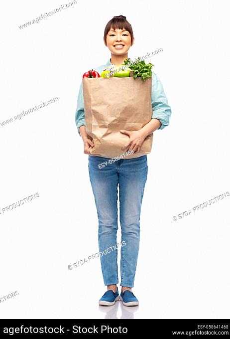 happy smiling asian woman with food in paper bag