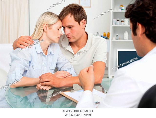 Frustrated couple just got bad news from their doctor