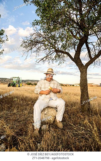 Farmer resting after work in his farmland. Made in August of 2013 in Caudé, a small village in Aragon, close to Teruel. Spain