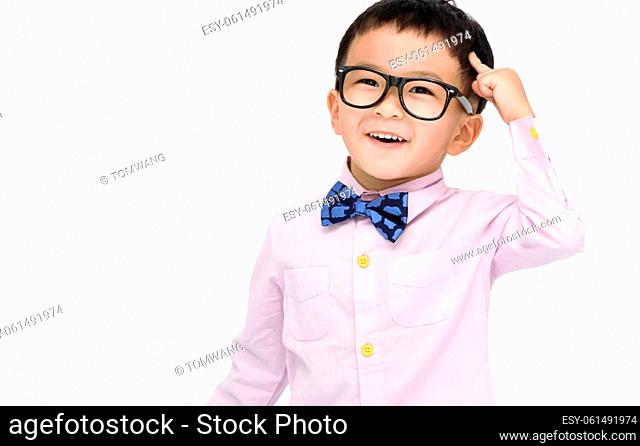 Smart kid standing over white background and pointing to head with one finger