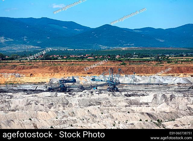 Brown coal open pit landscape with enormous digging excavator in Matra mine Hungary, east of Budapest