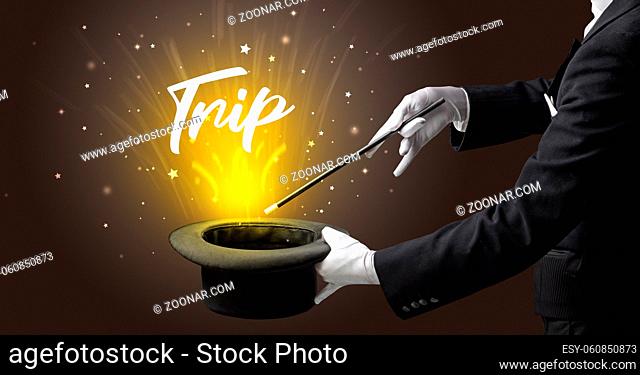 Magician is showing magic trick with Trip inscription, traveling concept