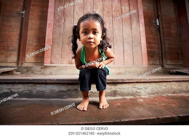 Cute little Asian girl looking at camera