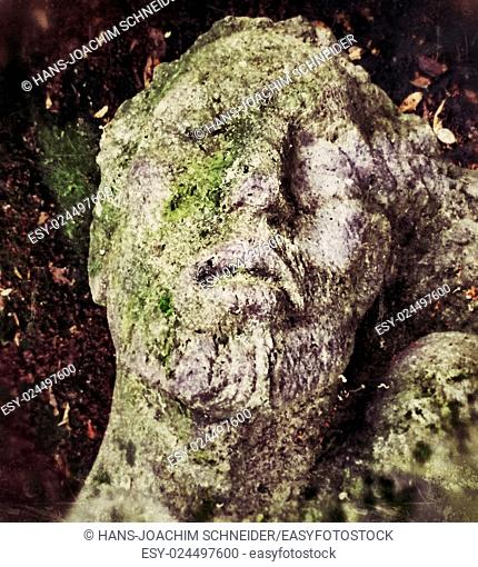 old grave figure in monochrome in vintage view