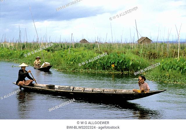 mother and daughter in a longboat on Inle Lake, Burma