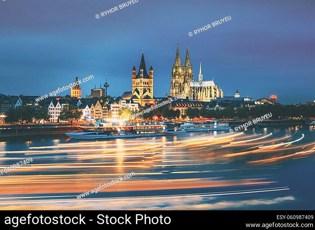 Cologne, Germany. Great St. Martin Church And Dom In Cologne At Evening With Reflection In River Rhine. Evening Blue Hour