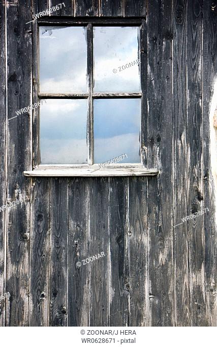 window in wood wall
