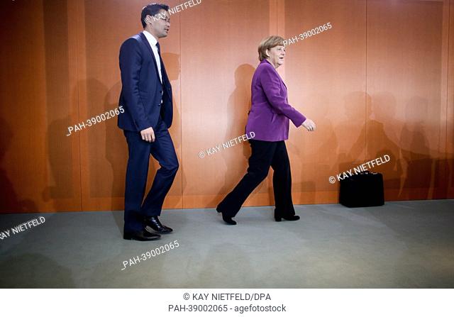 German chancellor Angela Merkel and Economy Minister Philipp Roesler attend the weekly cabinet meeting at the chancellery in Berlin, Germany, 24 April 2013