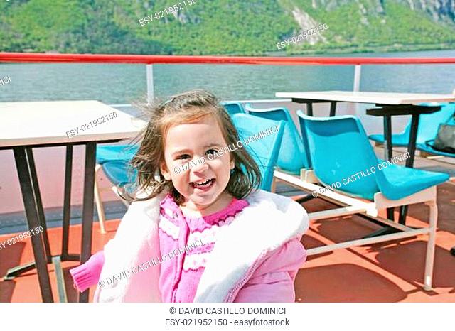 playful pretty little girl on sail boat in Lugano