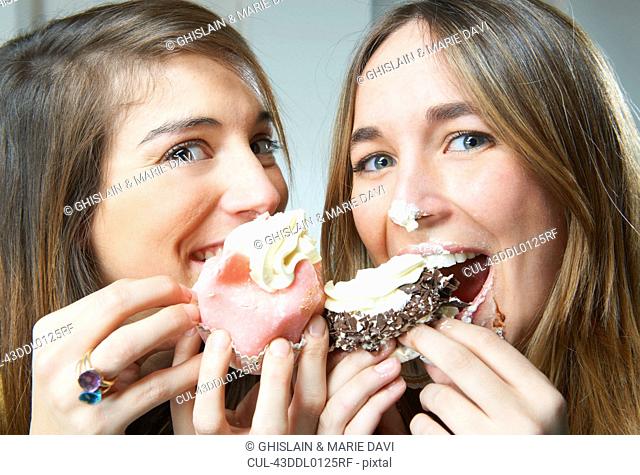 Women eating cupcakes together