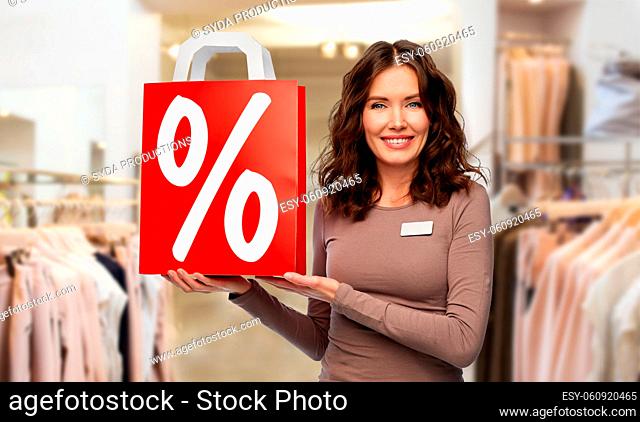 saleswoman with percentage sign on shopping bag