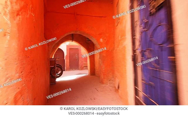 Walking through the narrow streets of the old medina in Marrakesh, Morocco, Africa