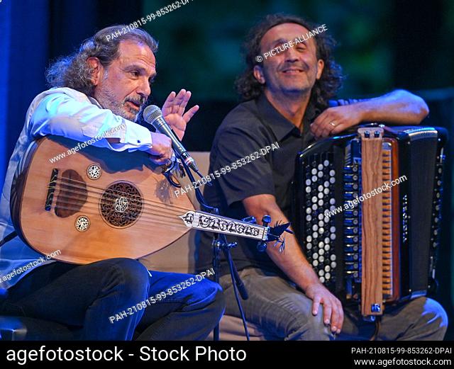 13 August 2021, Brandenburg, Neuhardenberg: Rabih Abou-Khalil (l), musician, with an oud (short-necked lute) and Luciano Biondini, Italian jazz accordionist
