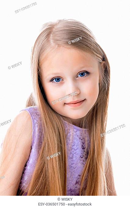 Portrait of beautiful blonde little girl in purple dress. Isolated on white