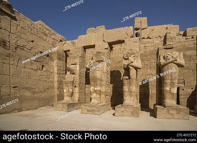 Osiride pillars with statues of Ramses III. Court/Temple of Ramses III. Temple of Karnak. El-Karnak, Luxor Governorate, Egypt, Africa, Middle East