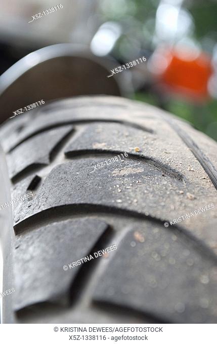 An angled close up of a motorcycle tire