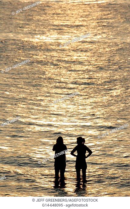 Indiana, Lake Michigan, Indiana Dunes State Park, Beverly Shores, teen girls, water, sunset