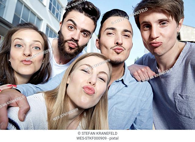 Group of friends pouting for a selfie