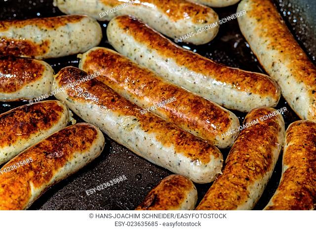 crispy sausages in a pan