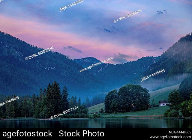 View across Hintersee towards Bindalm at dawn, Ramsau, Bavaria, Germany