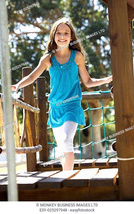 Young Girl Having Fun On Climbing Frame