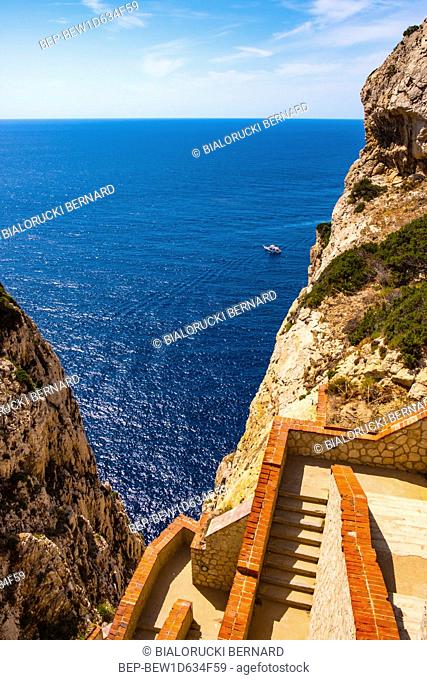 Alghero, Sardinia / Italy - 2018/08/11: Panoramic view of the Gulf of Alghero with cliffs of Cape Cappo Caccia over the Neptuneâ€™s Grotto