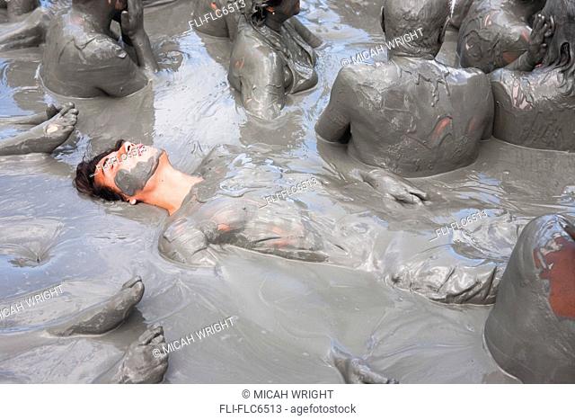 Tourists getting skin enhancing treatment at El Totumo Mud Volcano, Catagena, Colombia