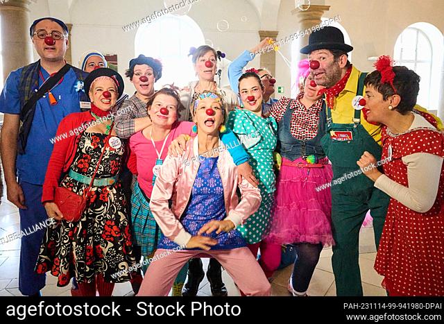 14 November 2023, Berlin: Clowns perform at the German Heart Center Berlin before the ""Little Noses, Big Impact"" press conference to mark the 20th anniversary...
