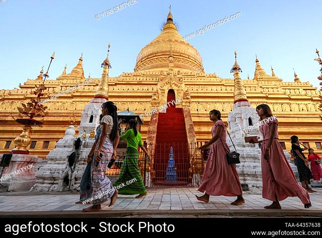 MYANMAR, BAGAN - OCTOBER 29, 2023: People are seen by a Buddhist temple. Yuri Smityuk/TASS