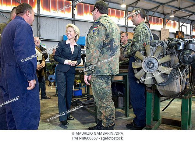 German Defence Minister Ursula von der Leyen visits a car repair shop where Kosovo security forces are trained by German soldiers at Camp Prizren in Kosovo