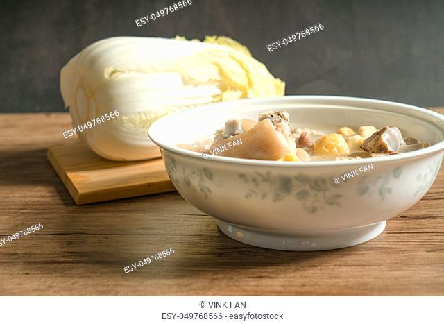 trotter soup with wooden background, homemade food, delicious soup