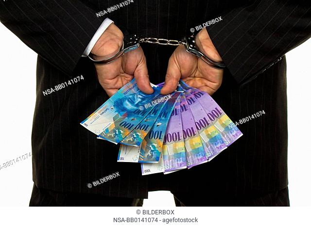 Manager, Swiss franc notes in his hand