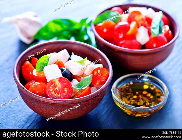 greek salad in bowl and on a table