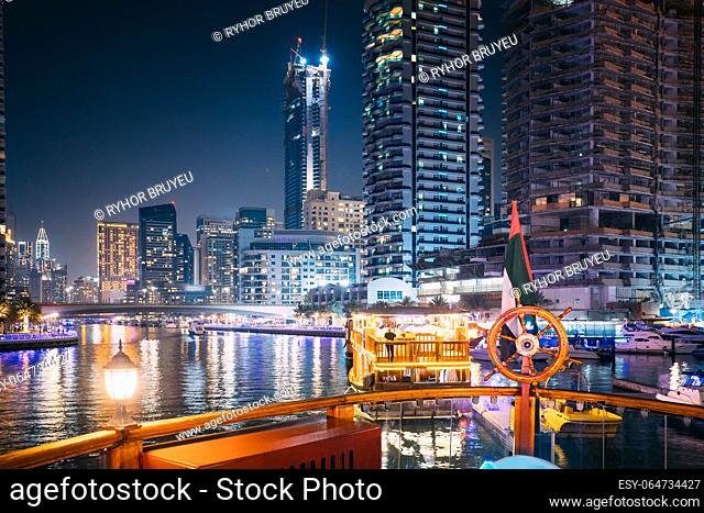 Night Walk On Tourist Boat, Sightseeing Boat Sailing On Dubai Marina. Night View Of Dubai Marina Is District in Dubai, United Arab Emirates
