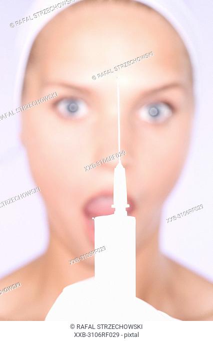 young woman with syringe