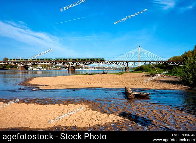Poland, city of Warsaw, Vistula River with sand beach and bridges, wild right shore