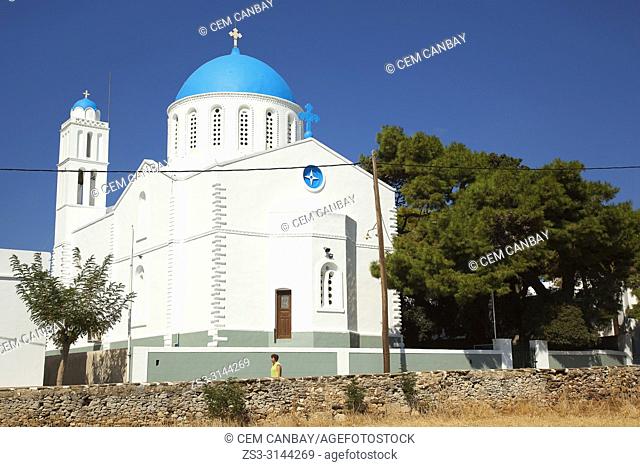 Woman in front of the Panagia Zoodohos Pigi Church in Kato Petali village, Sifnos Island, Cyclades Islands, Greek Islands, Greece, Europe