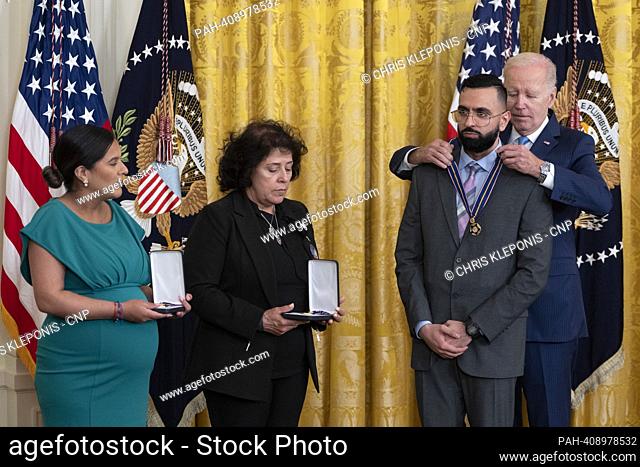 United States President Joe Biden presents the Medal of Valor to Detective Sumit Sulan of the New York City Police Dept. Gabina Mora (Mother)