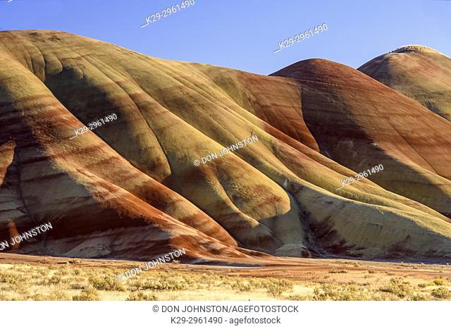 Eroded, exposed laterite and mudstone sediments in a sagebrush environment, John Day Fossil Beds National Monument, Painted Hills Unit, Mitchell, Oregon, USA