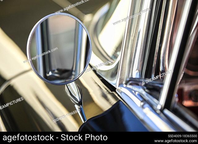 Detail of chrome side mirror on 1960 Old Sport Sedan