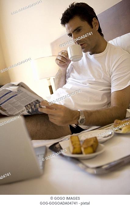 Man having breakfast in bed