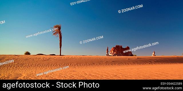 Sunrise at sandstone formation in the Sahara desert near Yoa Lake group of Ounianga Kebir in Ennedi, Chad