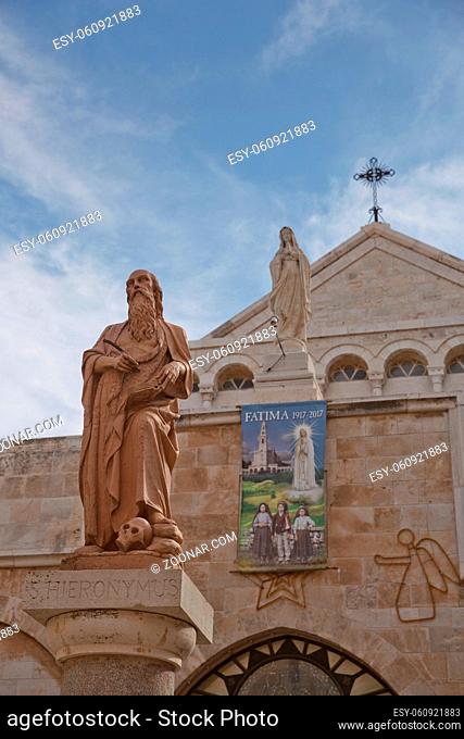 Bethlehem, Palestine, Israel - October 24, 2017: A statue of Saint Hieronymus outside The Church of the Nativity which is a basilica located in the West Bank of...