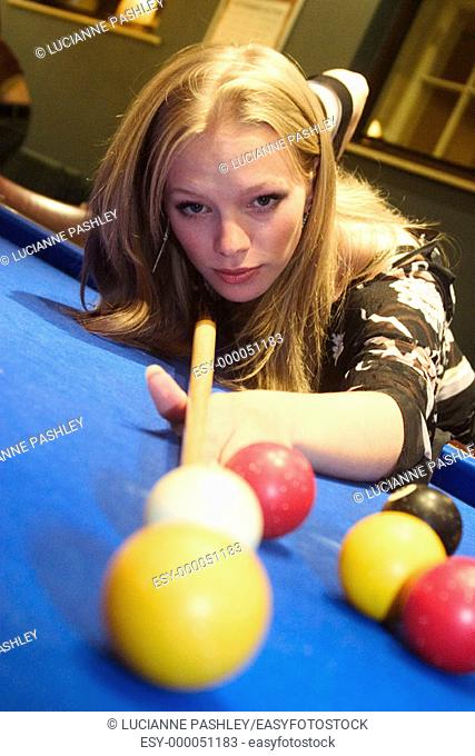 21 year old  girl bending over snooker table playing snooker