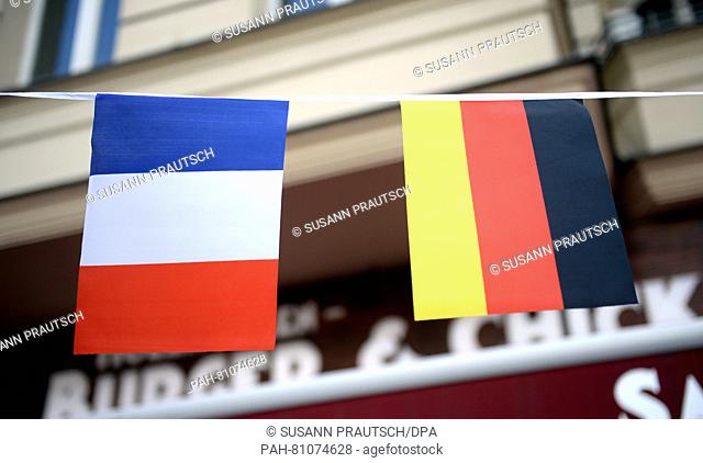 A French and a German flag hang in front of a shop in Berlin,  Germany, 09 June 2016. Photo: SUSANN PRAUTSCH/dpa | usage worldwide